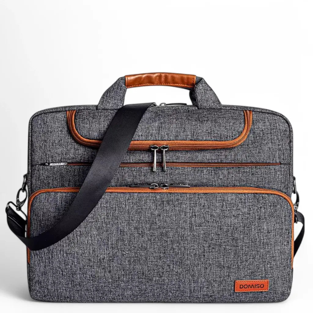 Brede laptoptas heren 17 inch bruin grijs met stijlvolle leren accenten, comfortabele schouderband en meerdere vakken, perfect voor de Nederlandse forens en zakelijke professional.