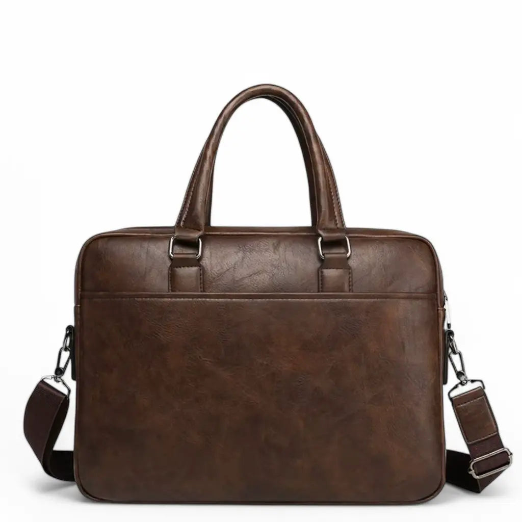 Vooraanzicht van exclusieve laptoptas heren 14 inch donkerbruin met elegant design, hoogwaardige metalen accessoires en duurzame leren constructie ideaal voor dagelijks gebruik.