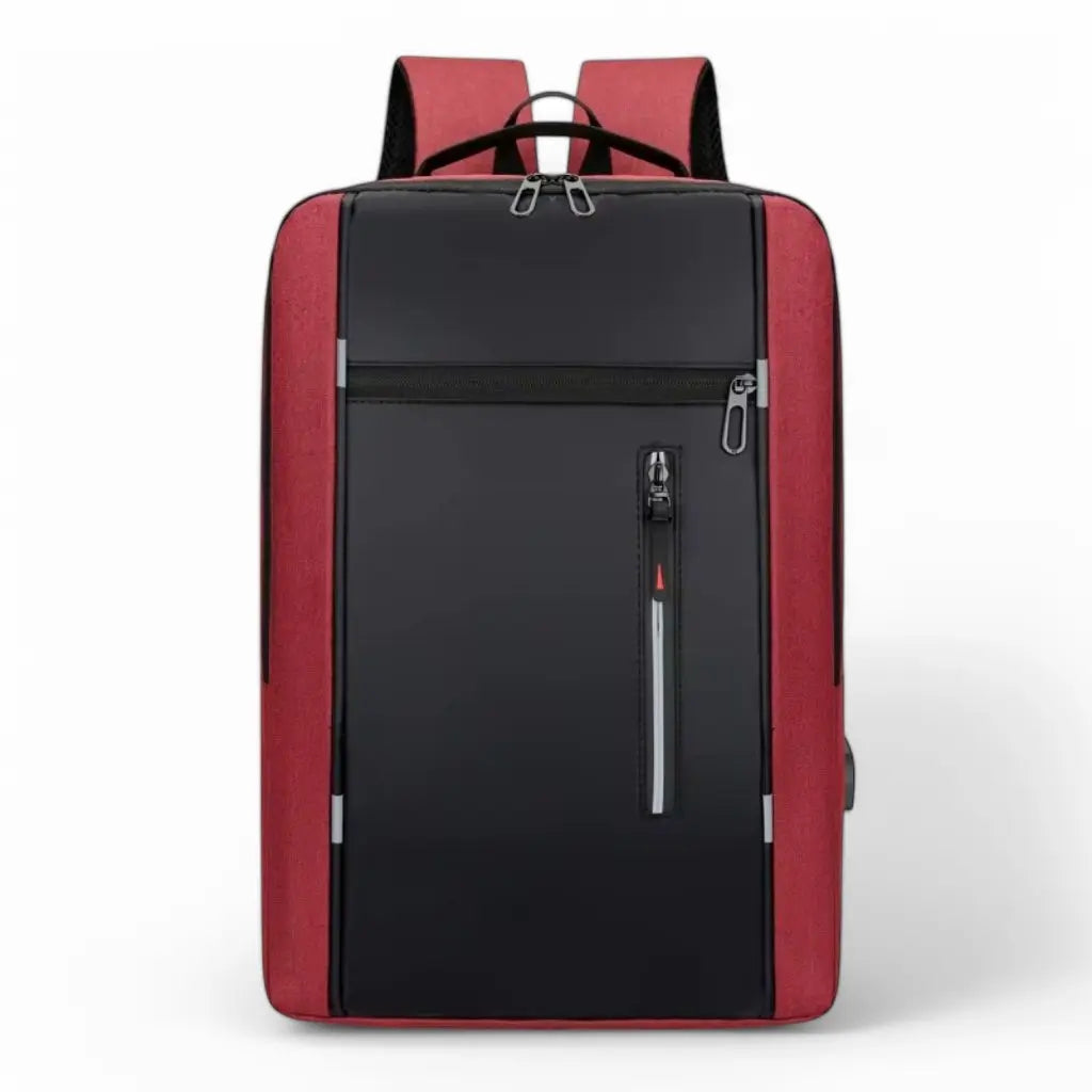 Een stijlvolle laptop rugzak heren 15.6 inch compact rood met zwart voorpaneel. Deze rugzak heeft een modern ontwerp met rode zijkanten en een zwart middenpaneel. Voorzien van meerdere vakken met ritssluiting, waaronder een verticale rits met reflecterende streep voor extra zichtbaarheid in het donker. De compacte vormgeving biedt een goede balans tussen functionaliteit en een opvallende zakelijke uitstraling.