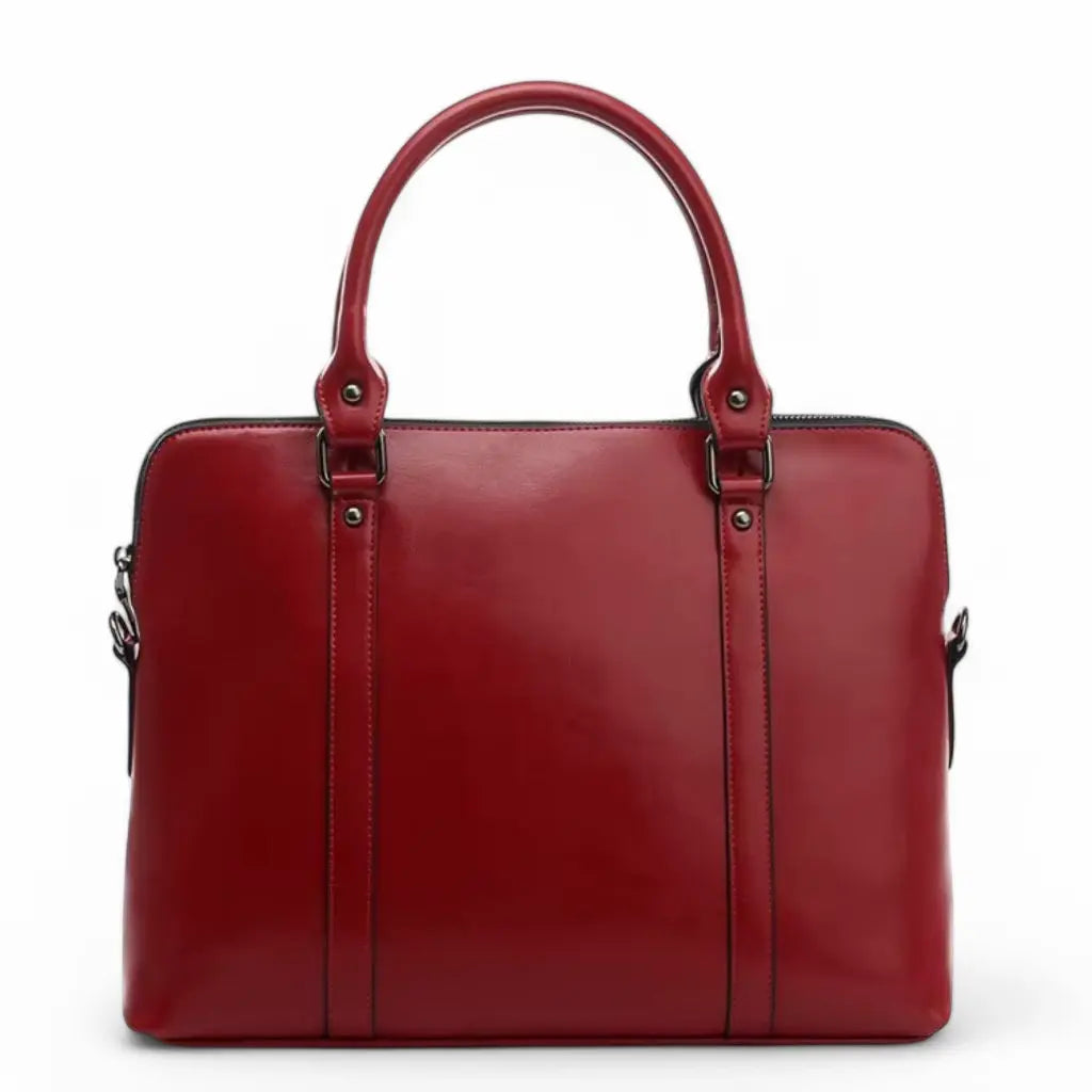 Leren laptoptas dames 14 inch rood met elegant design, hoogwaardige afwerking, stijlvolle handgrepen en metalen bevestigingspunten, perfect voor de moderne Nederlandse zakenvrouw die op zoek is naar zowel functionaliteit als stijl.