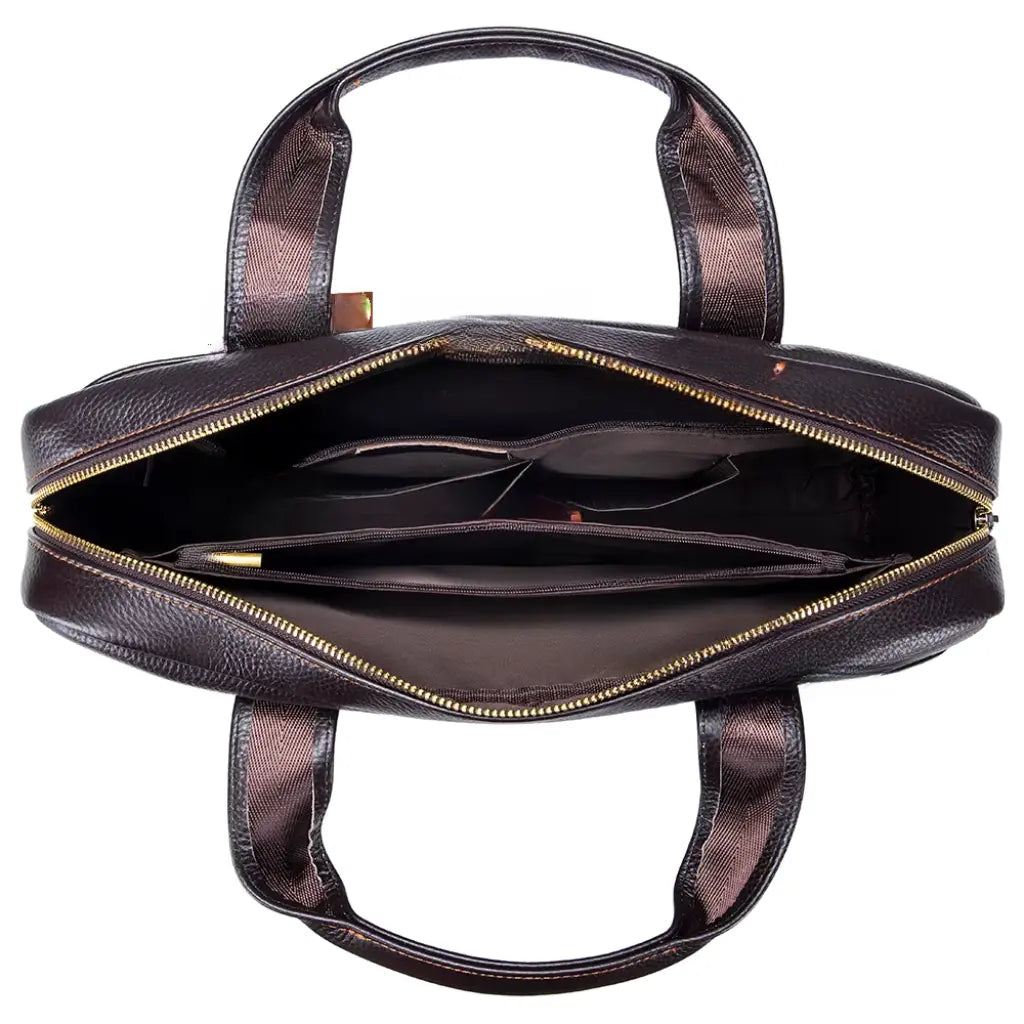 Bovenaanzicht van open leren laptoptas heren 13.3 inch met meerdere compartimenten en gouden rits.